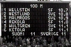 Kuva: Voitto Hellstenin nimi 100 metrin juoksun ykksen Helsingin Olympiastadionin tulostaululla. (1956) YLE kuvanauha.