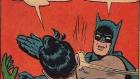 Kuvassa on piirretty kuva Batman-sarjakuvasta, jossa Batman läpsäisee Robinia.